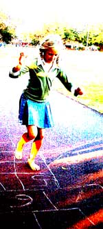 child playing hopscotch
